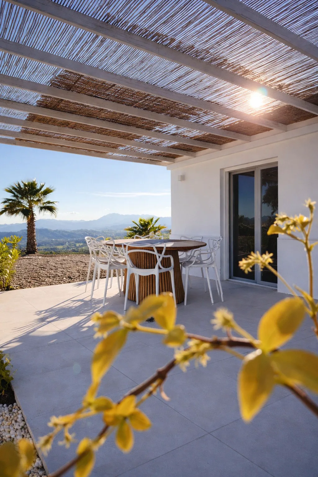 Covered terrace at Casa Lux with mountain views
