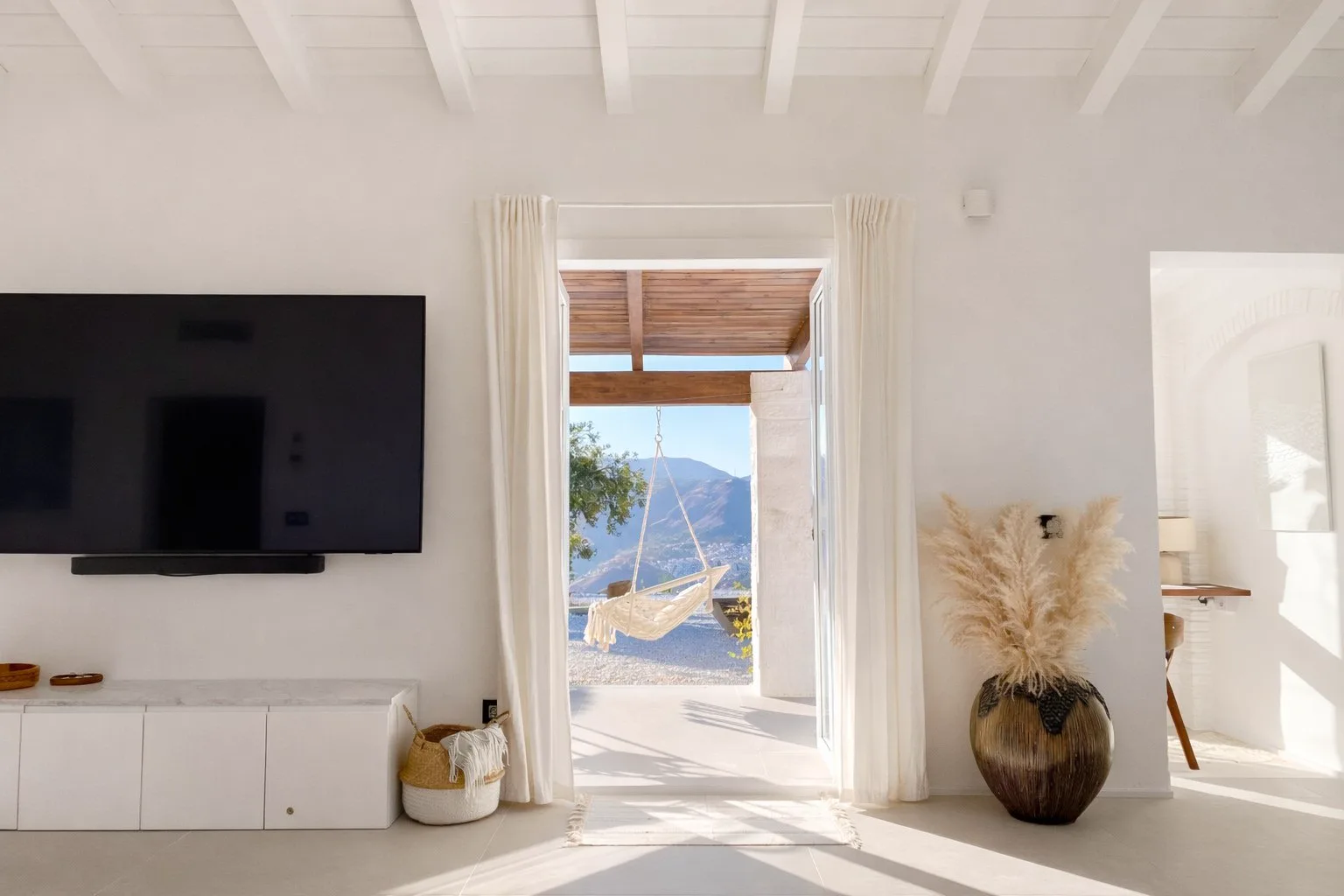 Casa Lux terrace doorway opening to outdoor living and mountain views