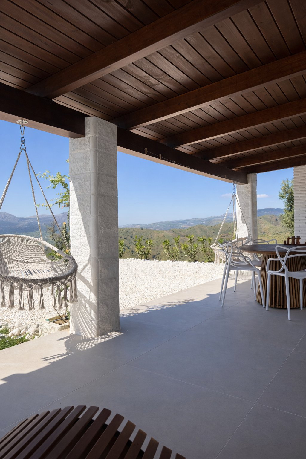 Covered dining terrace at Casa Lux with mountain and valley views
